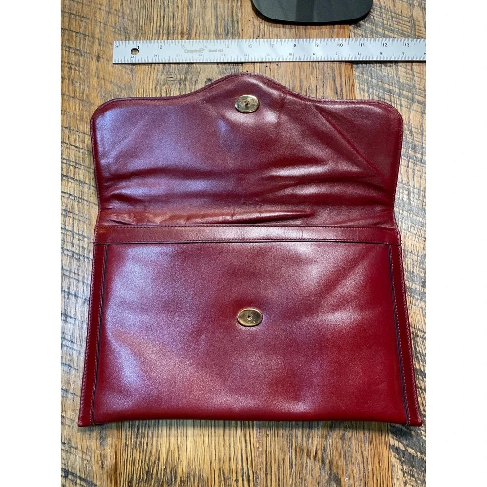 Elegant‎ Burgundy Etienne Aigner Leather Clutch Handbag with Gold Oval Accent